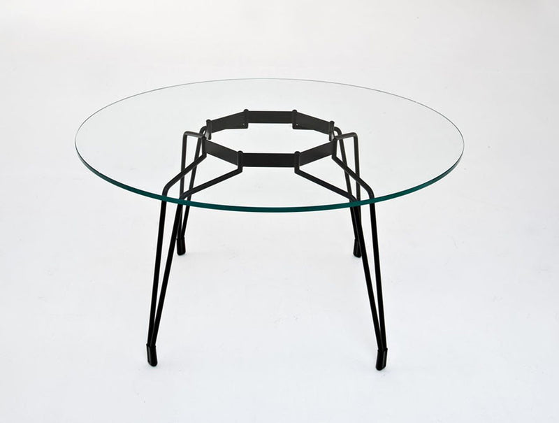 Diamond shape modern table with glass top and black legs