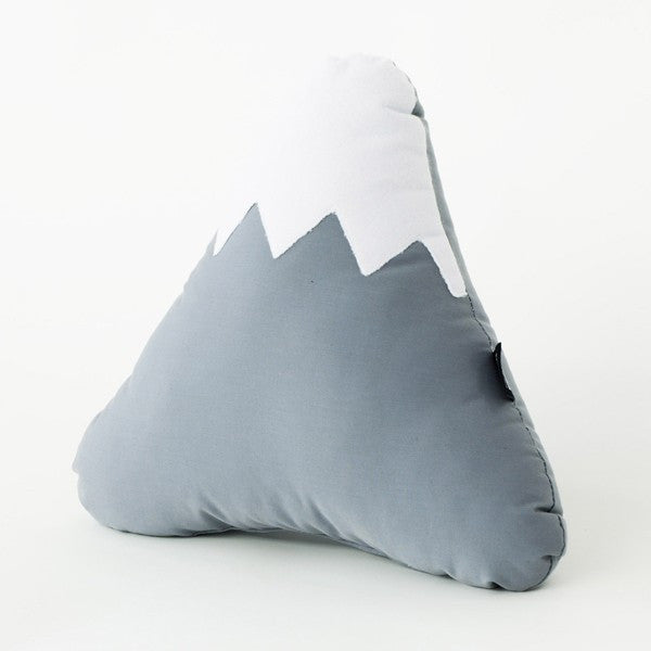 grey and white mountain shaped pillow